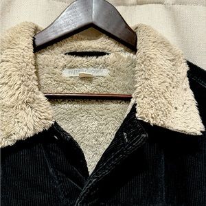 Black Sherpa lined wool trucker jacket, size large. Brand is OUTER KNOWN.
